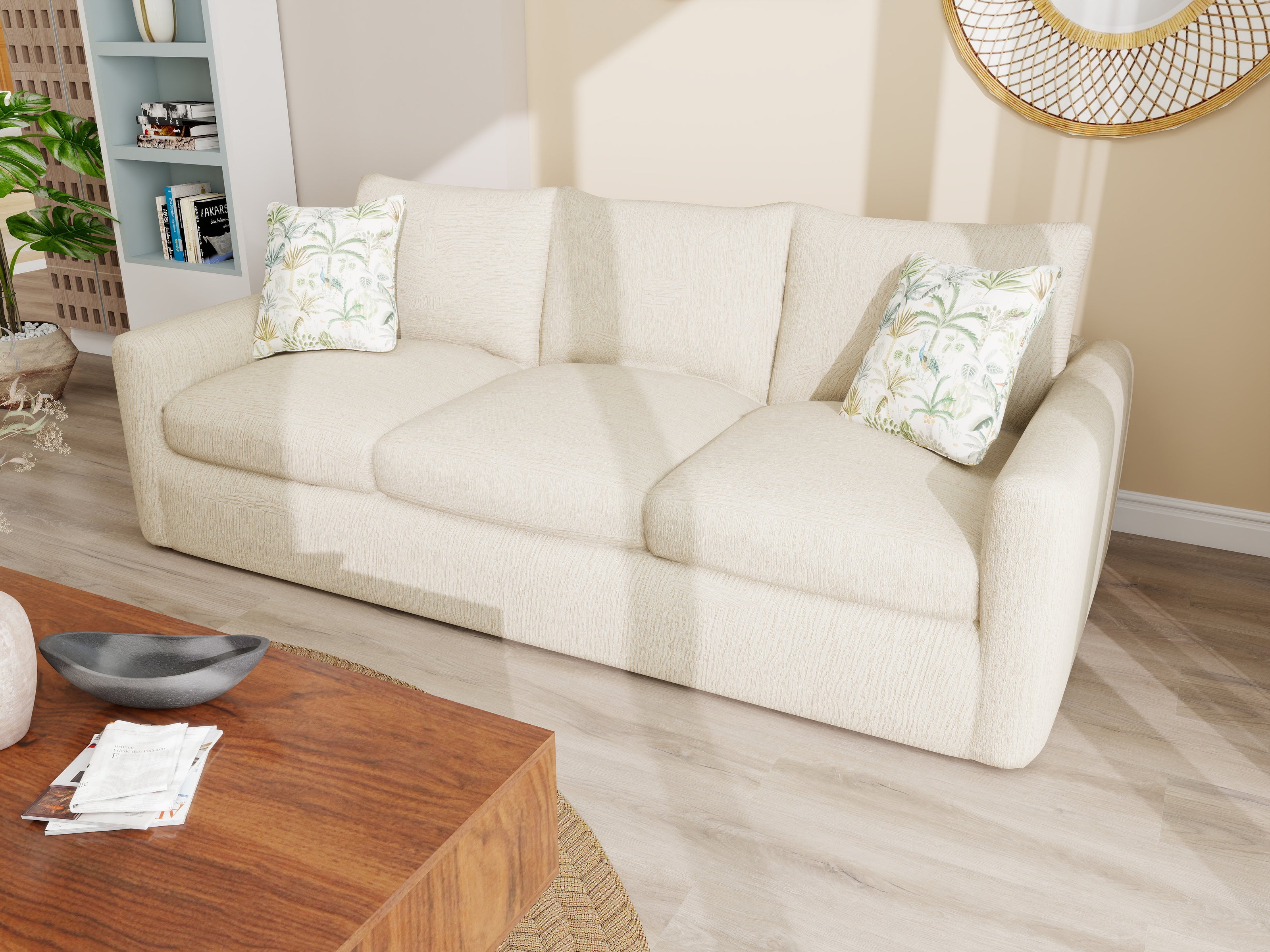 Clayhaven beige 3-seater fabric sofa with curved arms and three seat cushions, styled with botanical pillows in a modern living room.