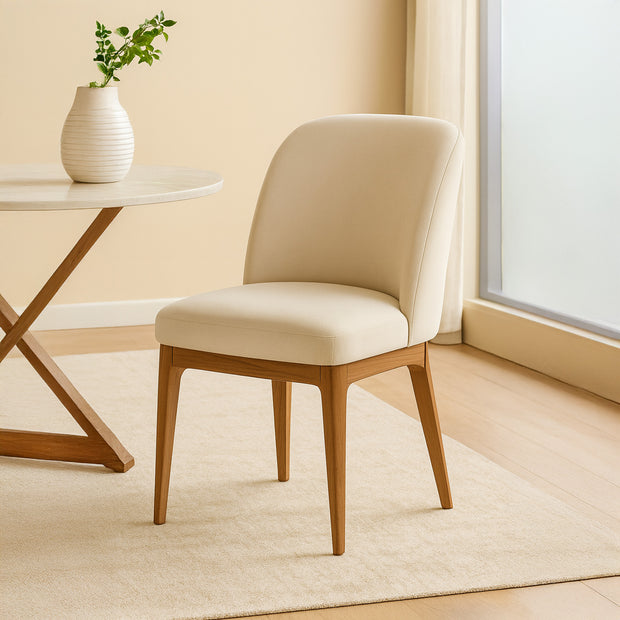 ELAN Maison modern luxury dining chair with curved back and upholstered seat