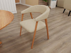 Sable Curve dining chair in beige upholstery with curved wraparound back and natural wood frame.