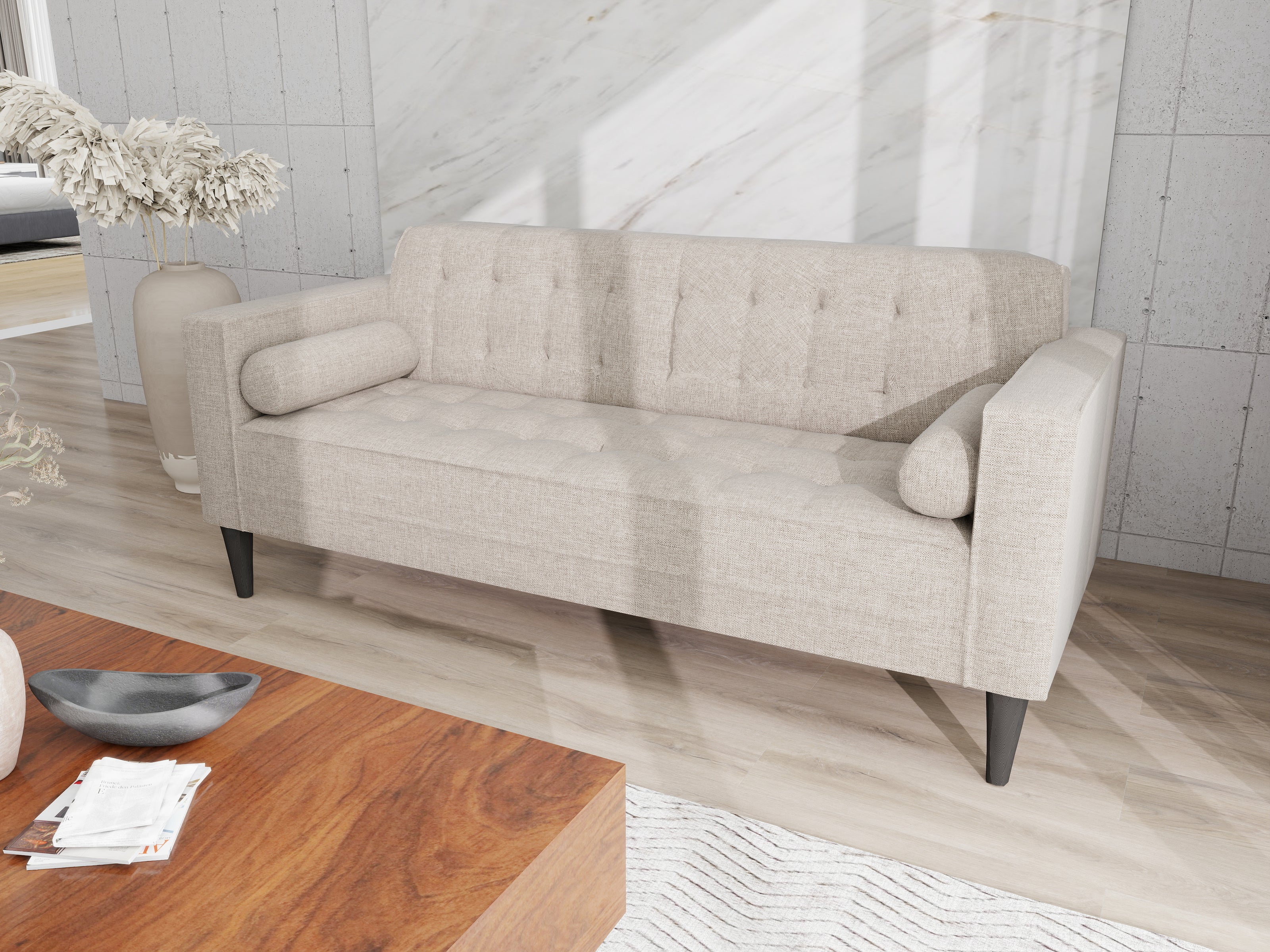 Arcadia grey 3-seater fabric sofa with tufted back and seat, bolster cushions, and dark tapered legs.