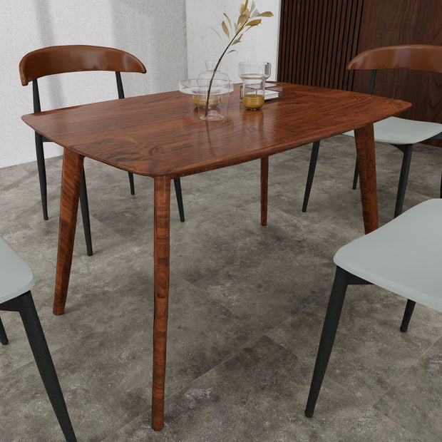 Arbor dining table styled with cream chairs in dining room