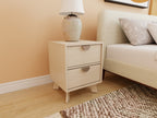 Crafted Poise bedroom package — off-white upholstered bed with nightstands and neutral rug